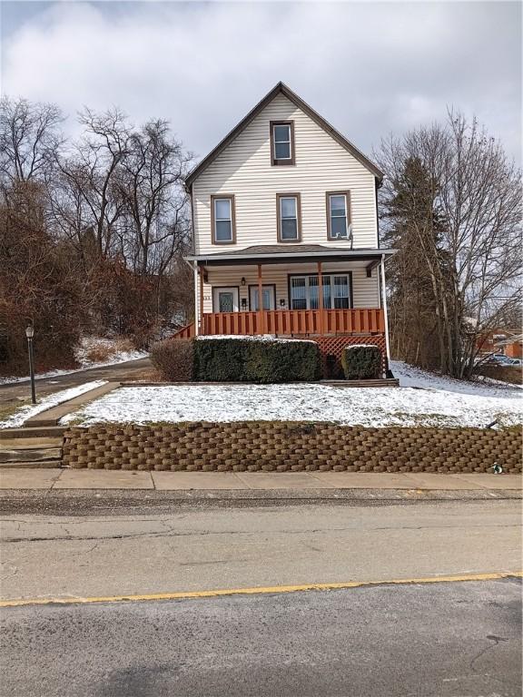 front of property featuring a porch