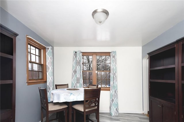 dining space with light wood-type flooring