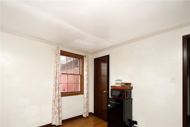 empty room with wood-type flooring