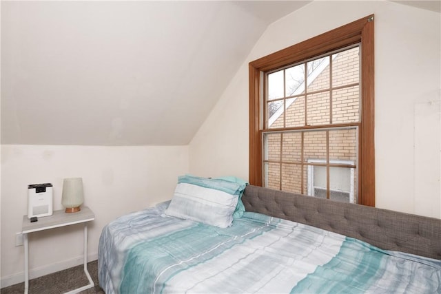 bedroom with carpet and vaulted ceiling