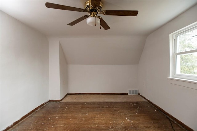 bonus room with vaulted ceiling and wood-type flooring