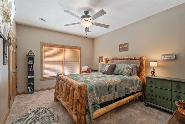 bedroom with ceiling fan and light carpet