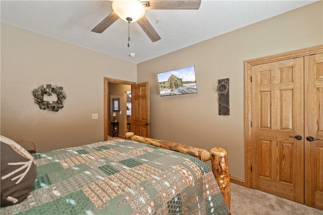 carpeted bedroom with ceiling fan