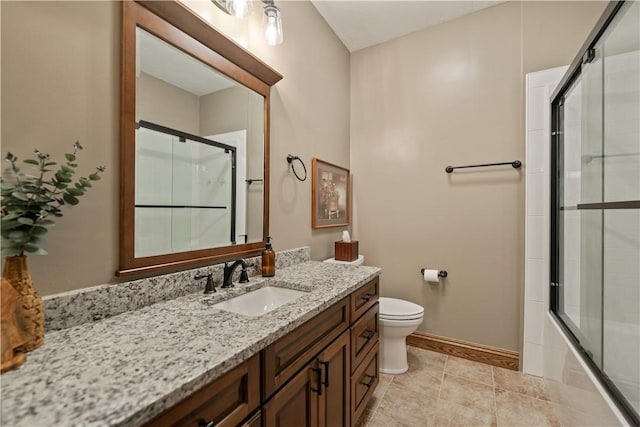 full bathroom featuring toilet, shower / bath combination with glass door, vanity, and tile patterned flooring