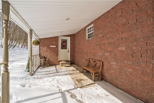 view of snow covered property entrance