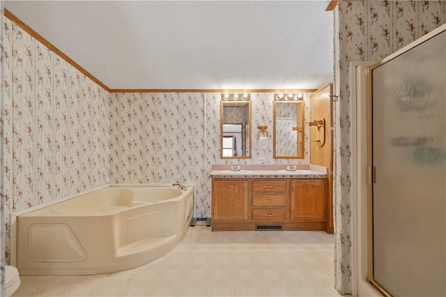 bathroom featuring a textured ceiling, independent shower and bath, vanity, and crown molding