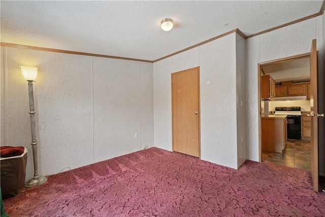 interior space with ornamental molding, a textured ceiling, and carpet flooring