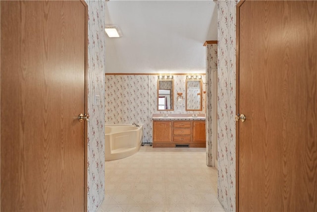 bathroom featuring a bathtub and vanity