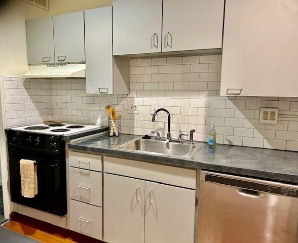 kitchen featuring dishwasher, dark countertops, black electric range oven, under cabinet range hood, and a sink