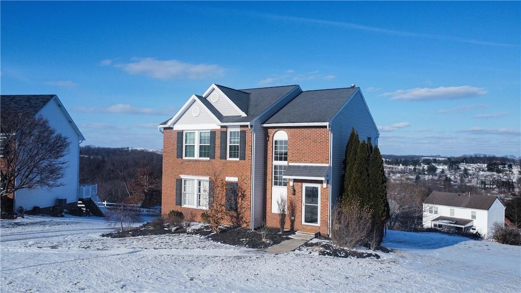 traditional-style home featuring brick siding