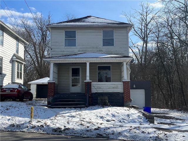 american foursquare style home featuring covered porch