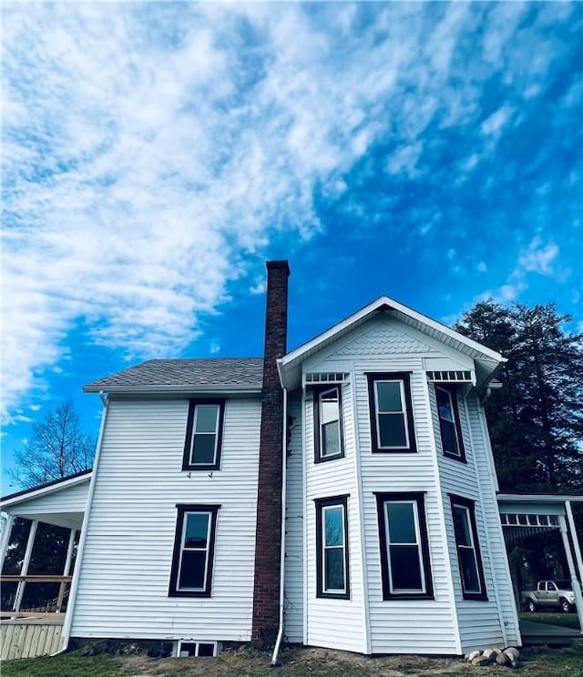 rear view of house with a chimney