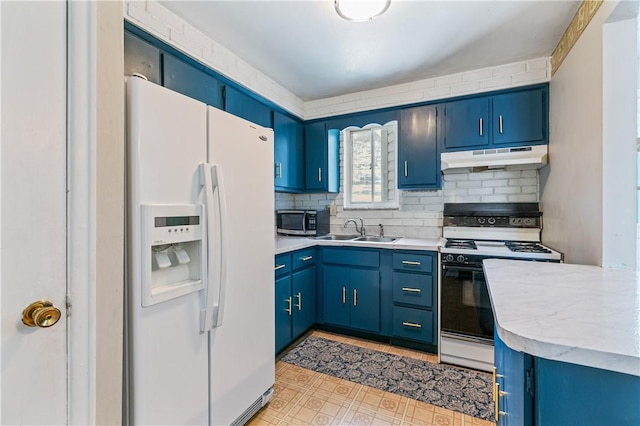kitchen with blue cabinets, a sink, range with gas stovetop, white refrigerator with ice dispenser, and under cabinet range hood