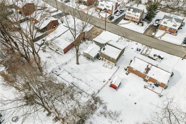 snowy aerial view featuring a residential view