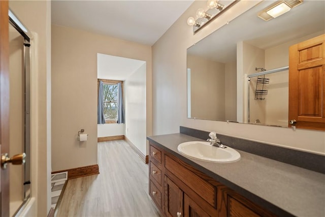 169 Clearview Rd, Raccoon Twp, PA 15001 - bathroom featuring baseboards, wood finished floors, vanity, and a shower with door
