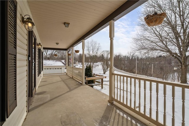 view of snow covered patio