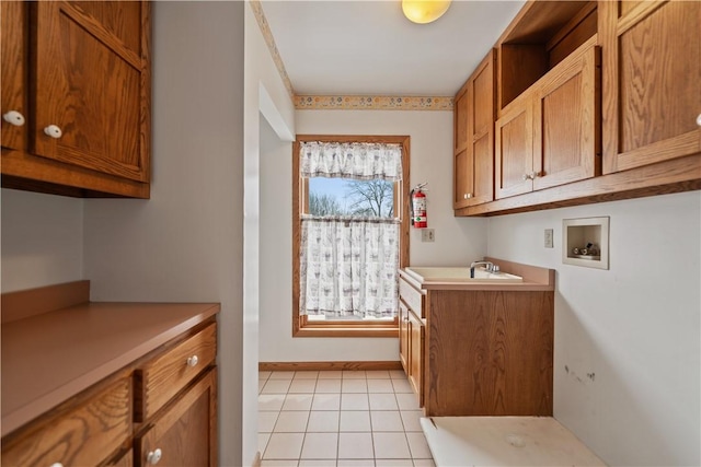 169 Clearview Rd, Raccoon Twp, PA 15001 - laundry room with a sink, light tile patterned flooring, washer hookup, and cabinet space