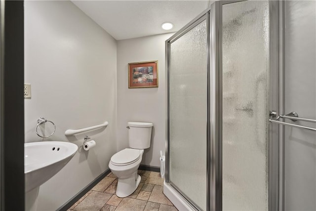 169 Clearview Rd, Raccoon Twp, PA 15001 - bathroom featuring a shower stall, baseboards, toilet, and stone finish flooring