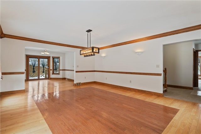 169 Clearview Rd, Raccoon Twp, PA 15001 - interior space with light wood-type flooring, ornamental molding, visible vents, a chandelier, and baseboards