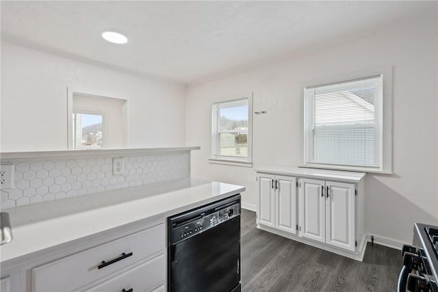 kitchen with dark wood-style floors, a healthy amount of sunlight, white cabinets, light countertops, and dishwasher