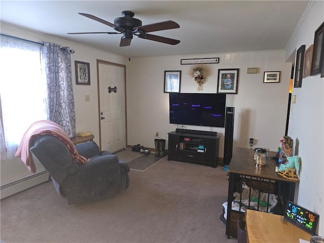 living area featuring ceiling fan, ornamental molding, baseboard heating, and carpet flooring