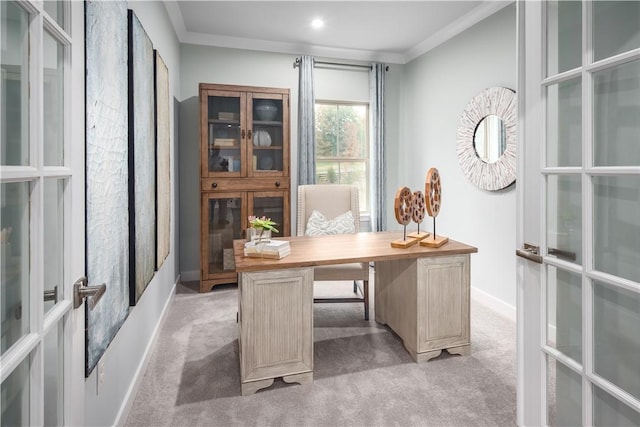 office area featuring baseboards, ornamental molding, and light colored carpet