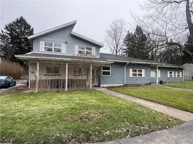 view of front facade with a front yard and covered porch