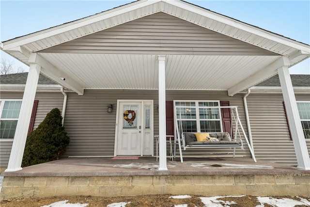 view of snow covered property entrance