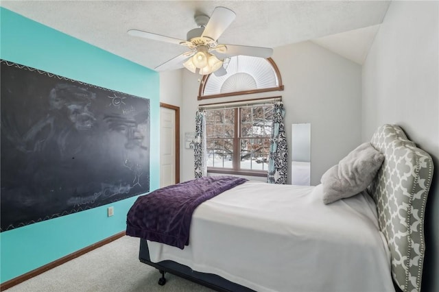 bedroom with a ceiling fan, lofted ceiling, and carpet