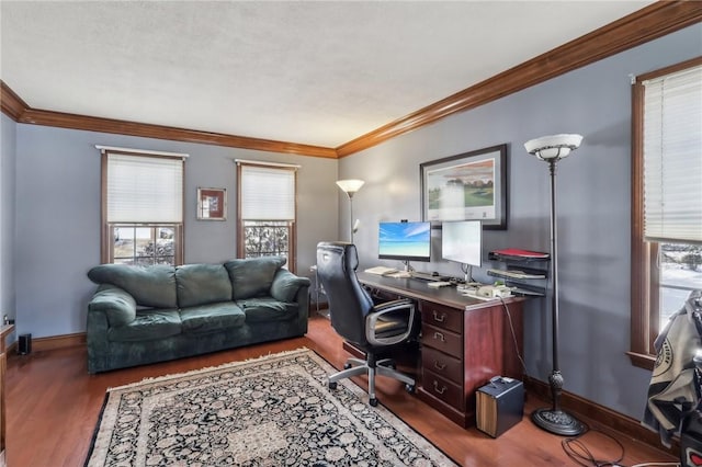 office area with dark wood-type flooring, crown molding, and baseboards