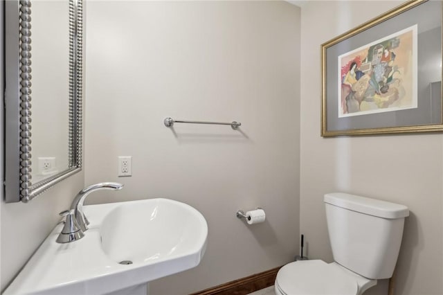 bathroom featuring toilet and a sink