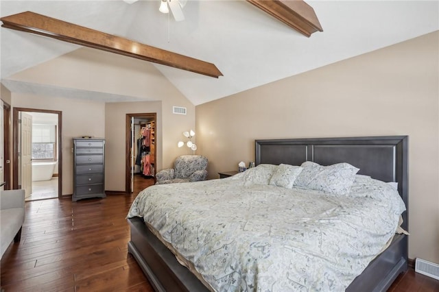 bedroom featuring vaulted ceiling with beams, dark wood-type flooring, and visible vents