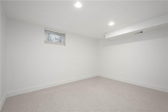 spare room with carpet, baseboards, and recessed lighting