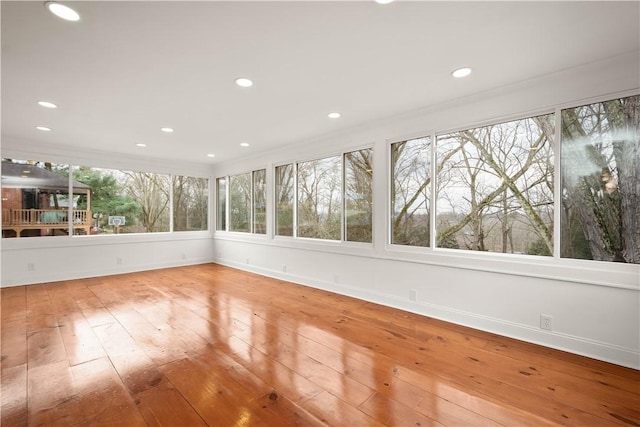 unfurnished sunroom featuring plenty of natural light