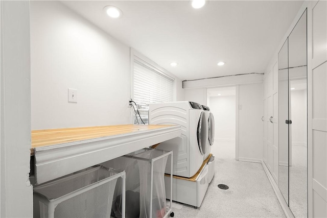 laundry room featuring laundry area, recessed lighting, and washing machine and clothes dryer