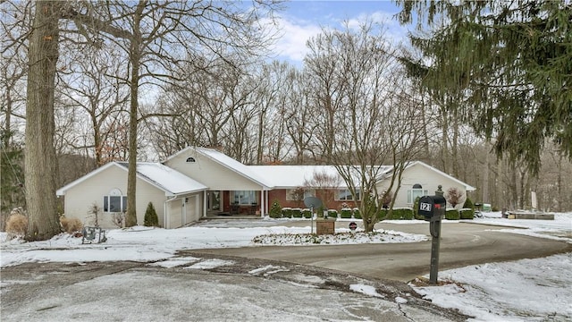 view of front of house featuring driveway and an attached garage