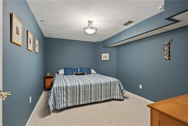 bedroom featuring light colored carpet, visible vents, and baseboards