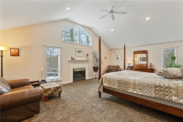 carpeted bedroom featuring baseboards, a glass covered fireplace, ceiling fan, high vaulted ceiling, and recessed lighting