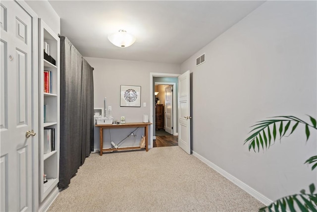 interior space featuring visible vents and baseboards