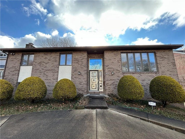 exterior space with brick siding