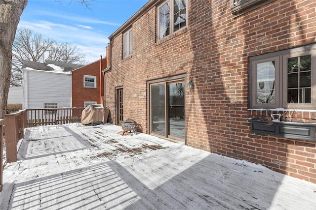 view of snow covered deck