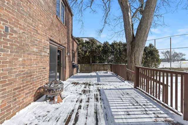 view of snow covered deck