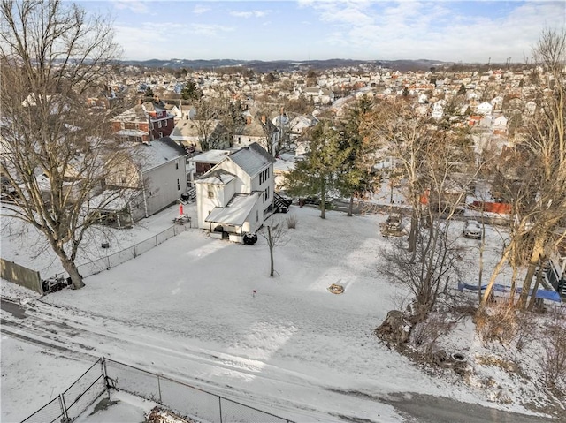 snowy aerial view with a residential view