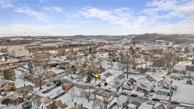 snowy aerial view featuring a residential view