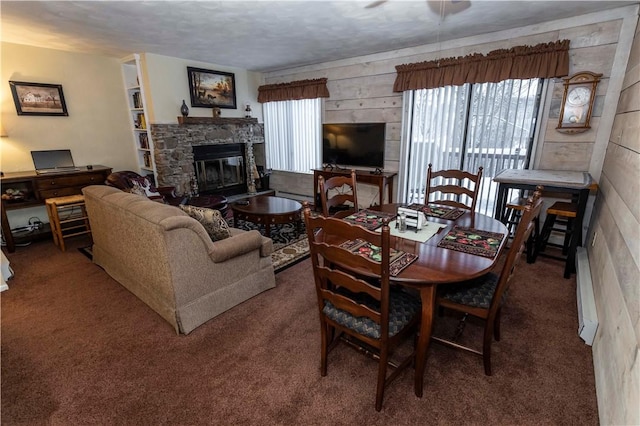 carpeted dining area featuring a fireplace