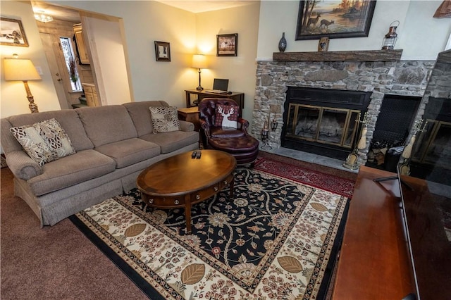 living area with a stone fireplace