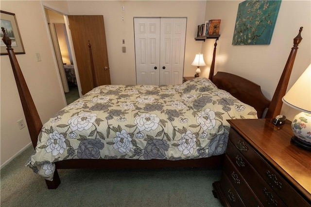 bedroom with dark colored carpet and a closet