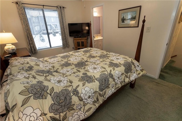 bedroom featuring carpet floors, baseboards, and ensuite bathroom