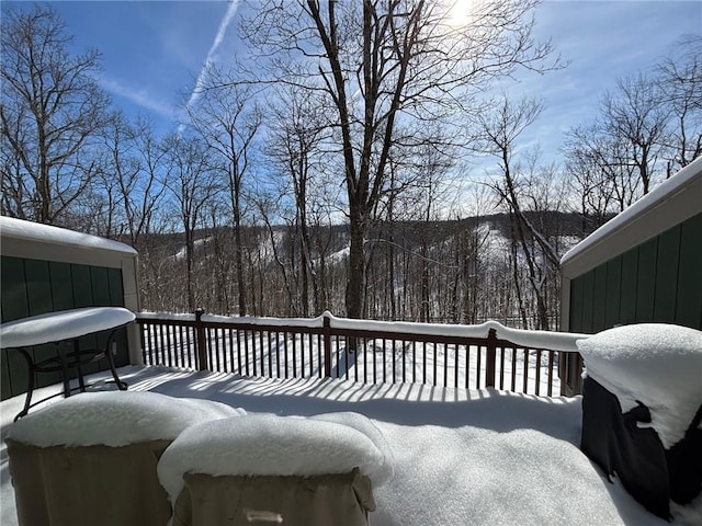 view of snow covered deck