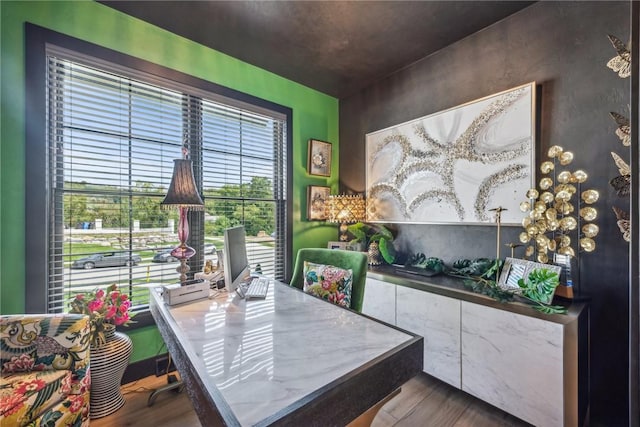 home office with wood finished floors
